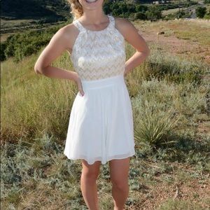 White and gold short dress.